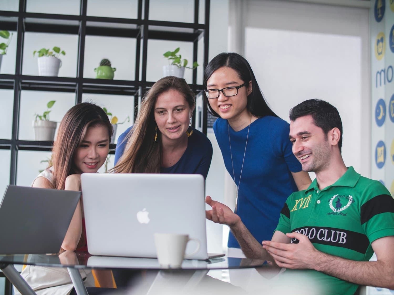 The SMAART Advisors team collaborating in the office